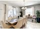 Well-lit dining room featuring a spacious wooden table, comfortable chairs, and sliding glass doors to the patio at 4704 Sleepy Hollow Dr, Kissimmee, FL 34746