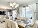 Open dining area with a chandelier, curtains, and a view of the pool at 4704 Sleepy Hollow Dr, Kissimmee, FL 34746