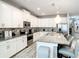 Modern kitchen features granite countertops, an island, and stainless steel appliances at 4704 Sleepy Hollow Dr, Kissimmee, FL 34746