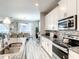 Bright kitchen featuring granite counters and stainless steel appliances at 4704 Sleepy Hollow Dr, Kissimmee, FL 34746