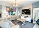 Inviting living room with a comfortable sofa, stylish decor, and a mounted TV for entertainment at 4704 Sleepy Hollow Dr, Kissimmee, FL 34746