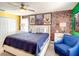 A well-lit main bedroom featuring contemporary decor, a ceiling fan, and neutral carpeting at 4704 Sleepy Hollow Dr, Kissimmee, FL 34746