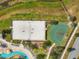 Aerial view showcasing the sand volleyball court and the basketball court, perfect for the sports enthusiast at 4704 Sleepy Hollow Dr, Kissimmee, FL 34746