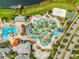 Aerial view showcasing water park, sand volleyball court, and basketball court, for relaxation and leisure at 4704 Sleepy Hollow Dr, Kissimmee, FL 34746