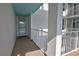 Balcony featuring white metal railings and a doorway leading inside at 5201 S Atlantic Ave # 405A, New Smyrna Beach, FL 32169