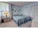 Bedroom featuring two twin beds, soft carpeting, and built in storage cabinets at 5201 S Atlantic Ave # 405A, New Smyrna Beach, FL 32169