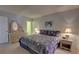 Bedroom showcasing the bed, bedside tables, and a dresser with a mirror at 5201 S Atlantic Ave # 405A, New Smyrna Beach, FL 32169