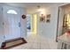 Bright entryway with white tile floors leading to other parts of the home at 5201 S Atlantic Ave # 405A, New Smyrna Beach, FL 32169