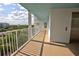 Hallway with light-colored floors and walls, white railings and an elevator at 5201 S Atlantic Ave # 405A, New Smyrna Beach, FL 32169
