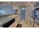 Bright kitchen offers white appliances, ample countertop space and eat in bar at 5201 S Atlantic Ave # 405A, New Smyrna Beach, FL 32169