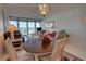 Bright living room featuring a view of the ocean, comfortable seating, and dining area at 5201 S Atlantic Ave # 405A, New Smyrna Beach, FL 32169