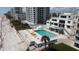 Aerial view of beachside community pool and deck at 5201 S Atlantic Ave # 405A, New Smyrna Beach, FL 32169