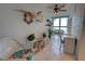 Bright sunroom with wicker furniture, offering a relaxing space with decorative accents at 5201 S Atlantic Ave # 405A, New Smyrna Beach, FL 32169