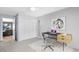 Bright bedroom featuring closet, carpet floor, and a desk with a laptop and chair at 5370 Whispering Pine Cir, St Cloud, FL 34771
