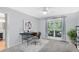 Office featuring a computer desk, office chair, a large window overlooking the yard, and a plant at 5370 Whispering Pine Cir, St Cloud, FL 34771