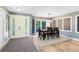 Formal dining area with wood floors, modern lighting, and a view to the porch at 5370 Whispering Pine Cir, St Cloud, FL 34771