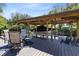 Dockside gazebo on the lake, featuring a seating area and covered boat slip with boat at 5370 Whispering Pine Cir, St Cloud, FL 34771