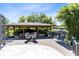Dockside gazebo on the lake, featuring a seating area and covered boat slip with boat at 5370 Whispering Pine Cir, St Cloud, FL 34771
