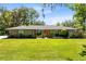 Charming single story home with a well-maintained lawn and rock accents at 5370 Whispering Pine Cir, St Cloud, FL 34771