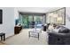 Comfortable living room with large sliding glass doors to the outdoor pool at 5370 Whispering Pine Cir, St Cloud, FL 34771