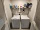 A functional laundry room includes a washer, dryer, and shelving for organized storage at 5526 Bonn Way, St Cloud, FL 34771