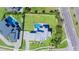 Aerial view of an estate showcasing the modern home, swimming pool, and lush landscaping on a spacious lot at 6106 Marleon Dr, Windermere, FL 34786