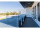Balcony with gray floors and glass railings overlooking the surrounding area at 6106 Marleon Dr, Windermere, FL 34786