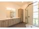 Modern bathroom with floating vanity, black faucet and glass enclosed shower at 6106 Marleon Dr, Windermere, FL 34786