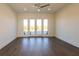 Bright bedroom with gray floors, ceiling fan, and sliding glass doors at 6106 Marleon Dr, Windermere, FL 34786