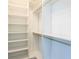 Spacious walk-in closet with custom white shelving and hanging racks at 6106 Marleon Dr, Windermere, FL 34786