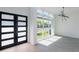 Bright entryway featuring a modern front door and large window overlooking the landscape at 6106 Marleon Dr, Windermere, FL 34786