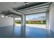 Spacious garage with modern overhead lighting and direct views of house at 6106 Marleon Dr, Windermere, FL 34786