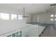 Open hallway with gray floors, glass railings, and recessed lighting at 6106 Marleon Dr, Windermere, FL 34786