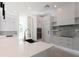 Bright kitchen with stainless appliances, a center island and a mosaic backsplash at 6106 Marleon Dr, Windermere, FL 34786