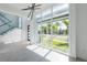Bright, open living room featuring a glass-railed staircase, tall windows, and modern finishes at 6106 Marleon Dr, Windermere, FL 34786