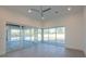 Open-concept living room with access to outdoor pool area via large sliding glass doors at 6106 Marleon Dr, Windermere, FL 34786