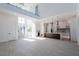 Open concept living space with modern kitchen, glass staircase, and lots of natural light at 6106 Marleon Dr, Windermere, FL 34786