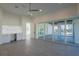 Living room with large sliding doors leading to outdoor pool area and a convenient built-in desk at 6106 Marleon Dr, Windermere, FL 34786
