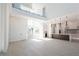 Open living room with soaring ceilings, modern lighting, and stairs leading to the second floor at 6106 Marleon Dr, Windermere, FL 34786