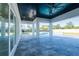Covered patio with ceiling fan and recessed lights, offering a comfortable outdoor living space with pool views at 6106 Marleon Dr, Windermere, FL 34786