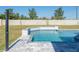 An inviting pool featuring an outdoor shower and sleek design, complemented by lush greenery at 6106 Marleon Dr, Windermere, FL 34786