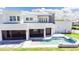Modern home with a stunning pool and outdoor living space, seamlessly blending indoor and outdoor lifestyles at 6106 Marleon Dr, Windermere, FL 34786