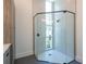 Glass shower with black trim, white tile and hexagon floor at 6106 Marleon Dr, Windermere, FL 34786