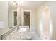 Bathroom features a granite countertop, tiled floor, and a glass-enclosed shower stall at 616 Conroy St, Orlando, FL 32805