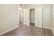 Bedroom featuring wood-look floors and access to a closet at 616 Conroy St, Orlando, FL 32805