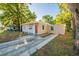 Charming single-story home with a red front door and concrete driveway at 616 Conroy St, Orlando, FL 32805
