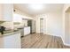 Charming kitchen features stainless steel appliances, granite counters, and wood-look flooring at 616 Conroy St, Orlando, FL 32805