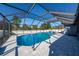 Large screened-in pool with blue water and ample deck space for lounging in the sun at 642 Nardello Dr, Deltona, FL 32725