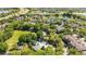 Aerial view of the community with a pool, playground, and nearby lakes at 6799 Helmsley Cir, Windermere, FL 34786