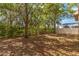 Expansive backyard area with mature trees and lush landscaping at 6799 Helmsley Cir, Windermere, FL 34786